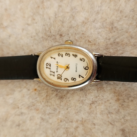 Watch by Sharp womens thin band battery watch. Delicate oval face and 14\